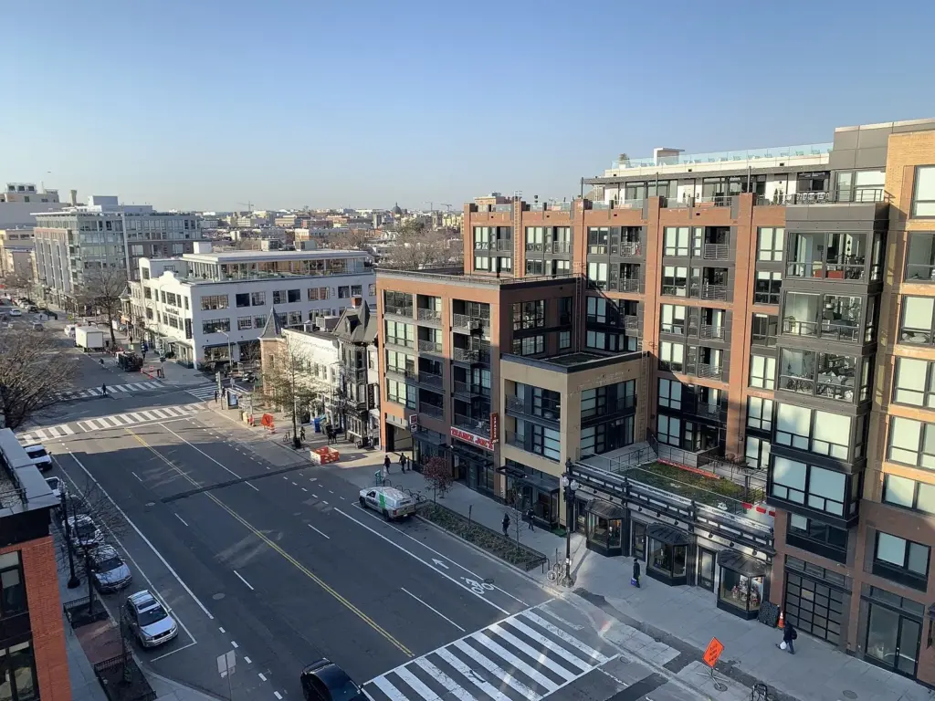 New apartment buildings and ground-floor restaurants along 14th Street NW seen from above
