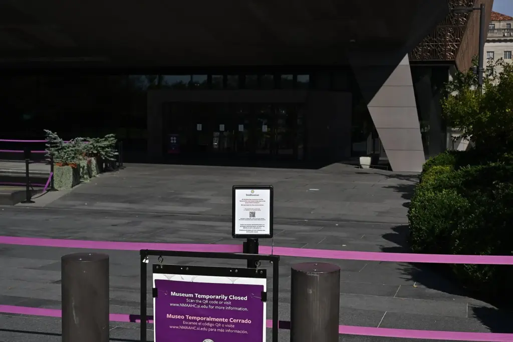 A Museum Temporarily Closed sign on a barrier outside the National Museum of African American History and Culture during the 2025 government shutdown