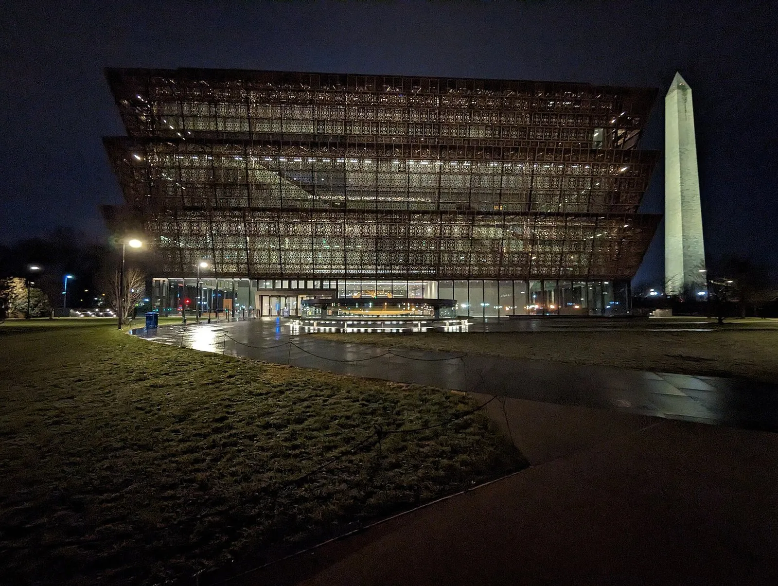 The African American history museum and the Washington Monument lit up at night, two of the sights that need timed entry passes Washington DC visitors book ahead