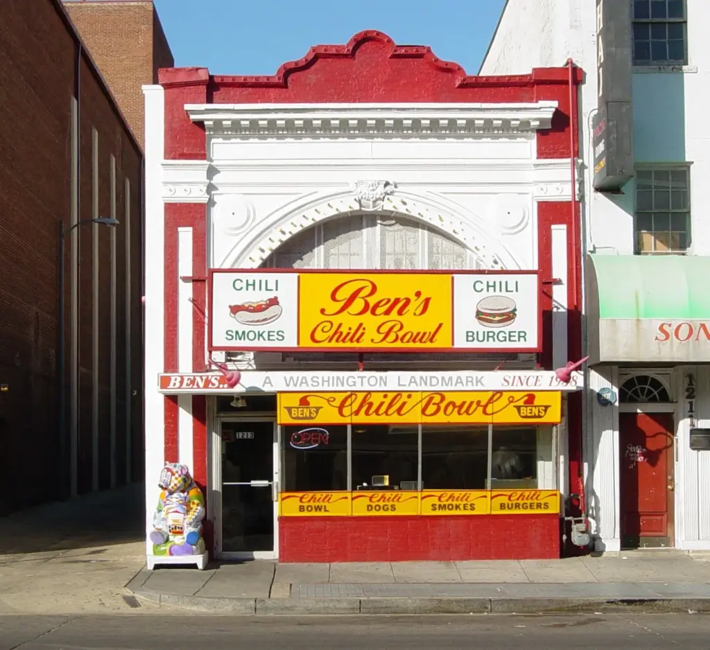 The red and white facade of Ben's Chili Bowl on U Street with its yellow sign