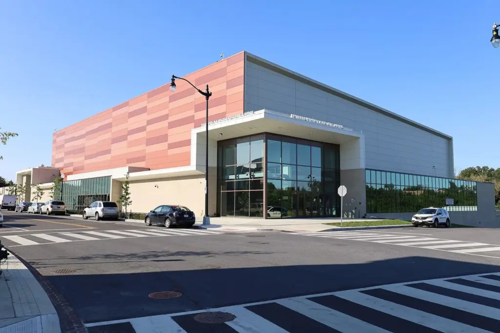 The glass entrance and red-paneled facade of CareFirst Arena in Congress Heights