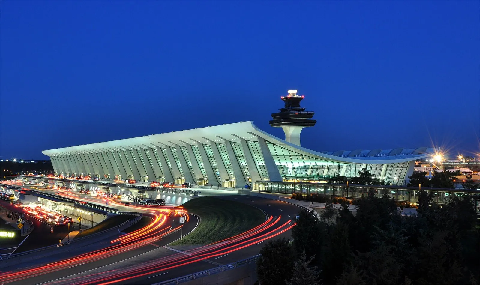 Dulles main terminal and control tower at dusk, the international gateway among the Washington DC airports