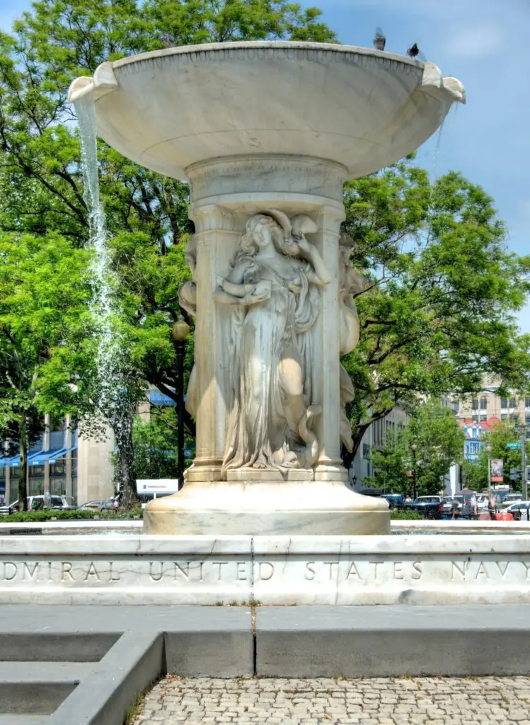 The white marble Dupont Circle fountain with carved figures under its basin