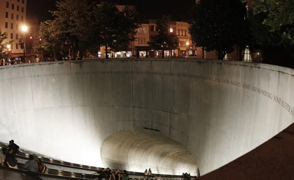 The deep escalator well of Dupont Circle Metro station's north entrance lit up at night