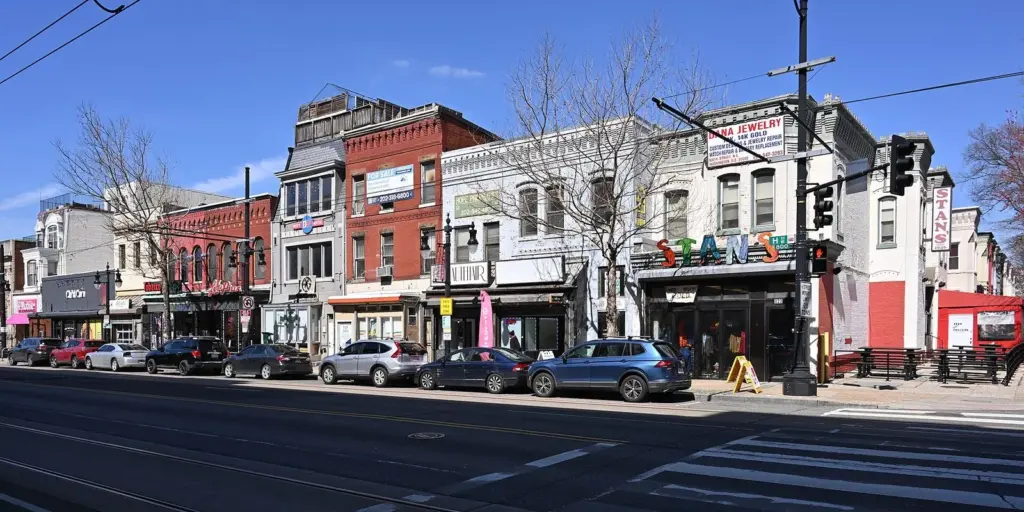 Rowhouse storefronts along the 800 block of H Street NE on a sunny March day