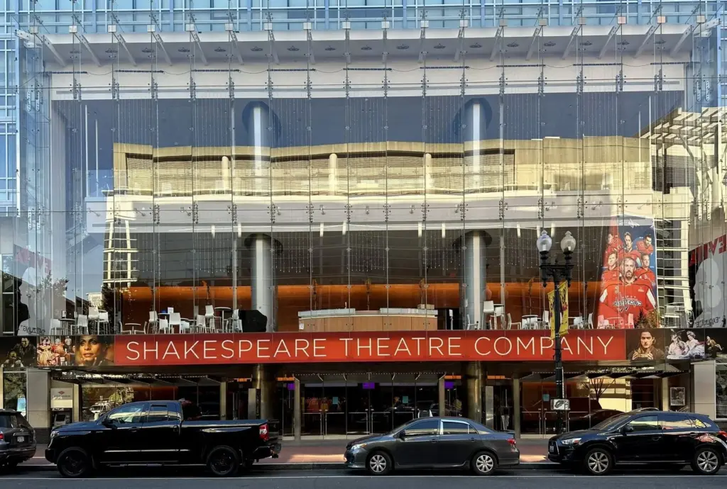 Harman Hall's glass facade and Shakespeare Theatre Company banner on F Street