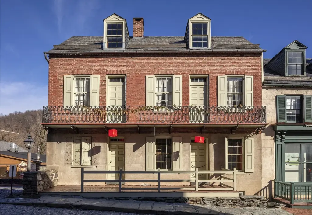 A brick and stone 19th-century building with iron balconies on High Street in Harpers Ferry