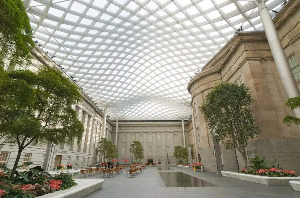 The Kogod Courtyard between the Portrait Gallery and American Art Museum, under a wavy glass-and-steel canopy