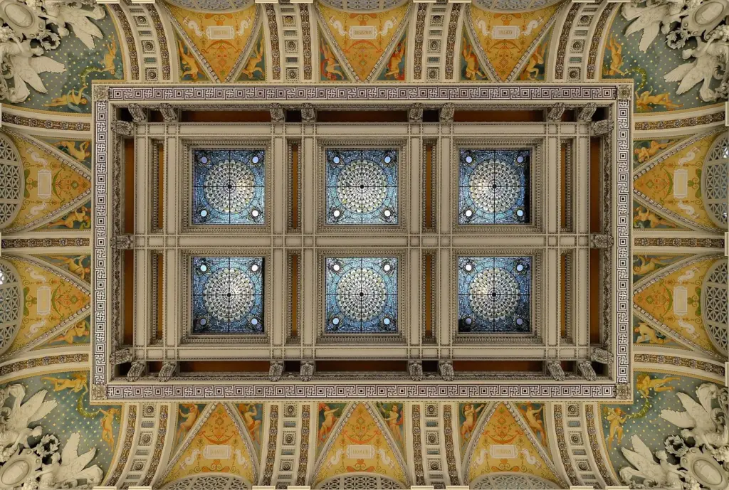 The ornate painted and gilded coffered ceiling of the Great Hall in the Library of Congress Thomas Jefferson Building