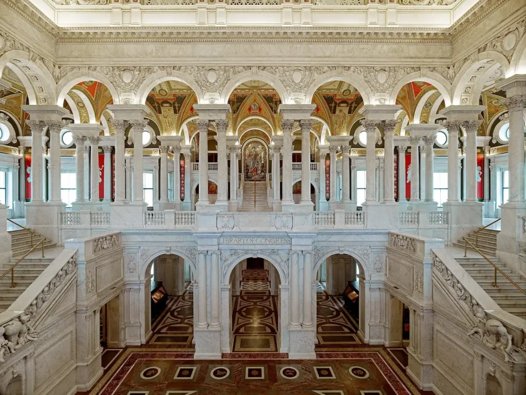 The marble Great Hall of the Library of Congress Jefferson Building, with its arches, staircases and painted ceilings