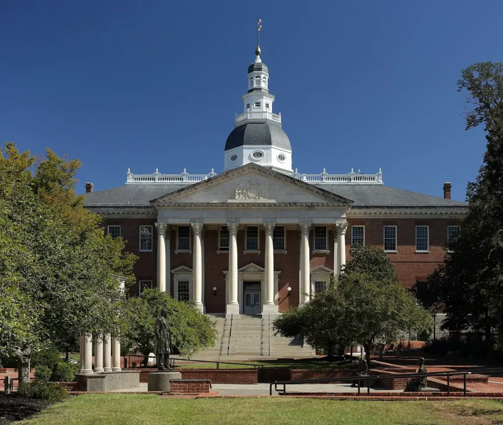 The Maryland State House's white columned portico and wooden dome in Annapolis