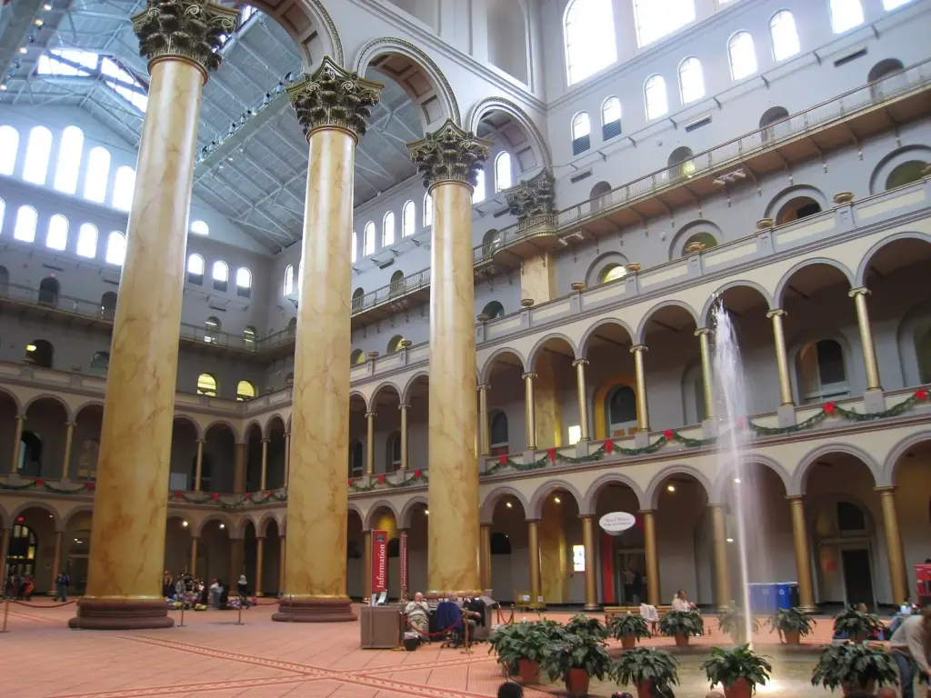 The vast Great Hall of the National Building Museum with giant columns, arcades and a fountain