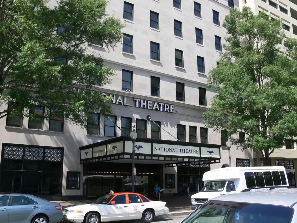 The National Theatre's marquee on Pennsylvania Avenue beneath its tall stone facade