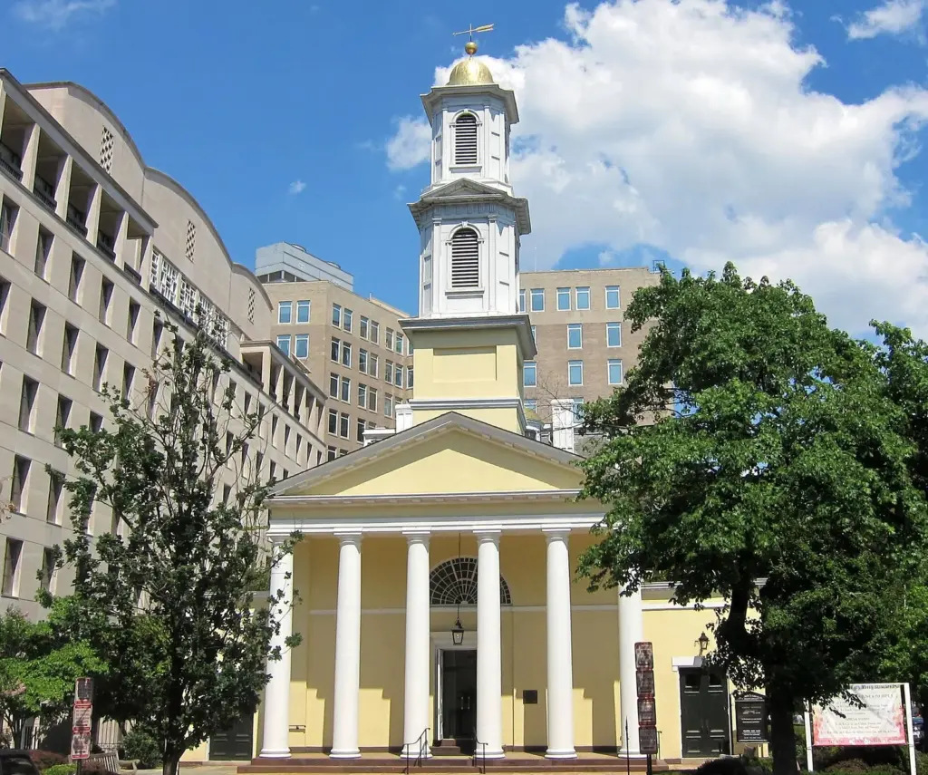 St. John's Church's yellow facade, white columns and bell tower on Lafayette Square