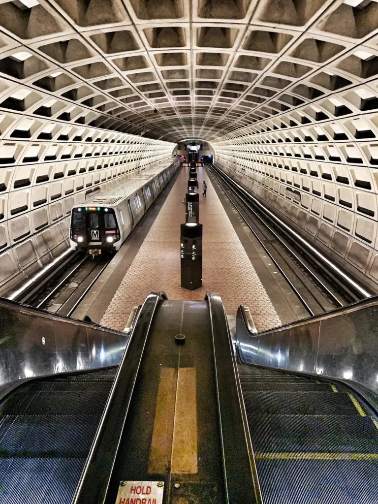 The coffered concrete vault and long escalators of U Street Metro station