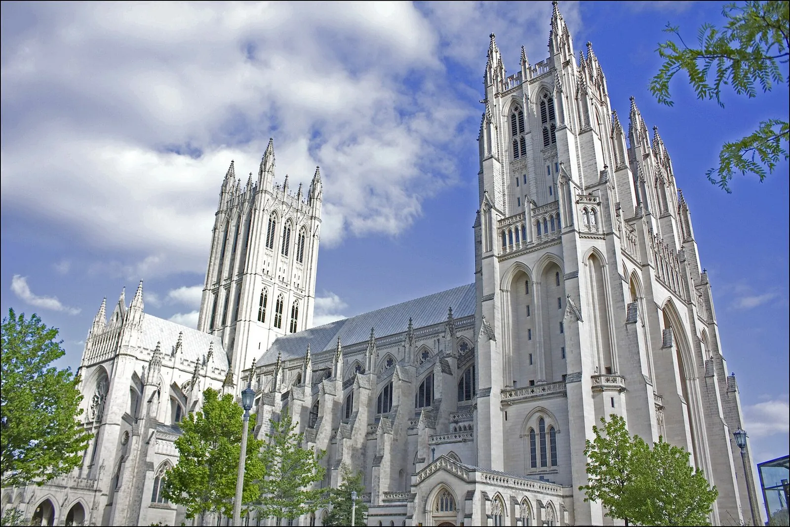 Gothic towers of the Washington National Cathedral against a blue sky, one of the major historic sites in Washington DC